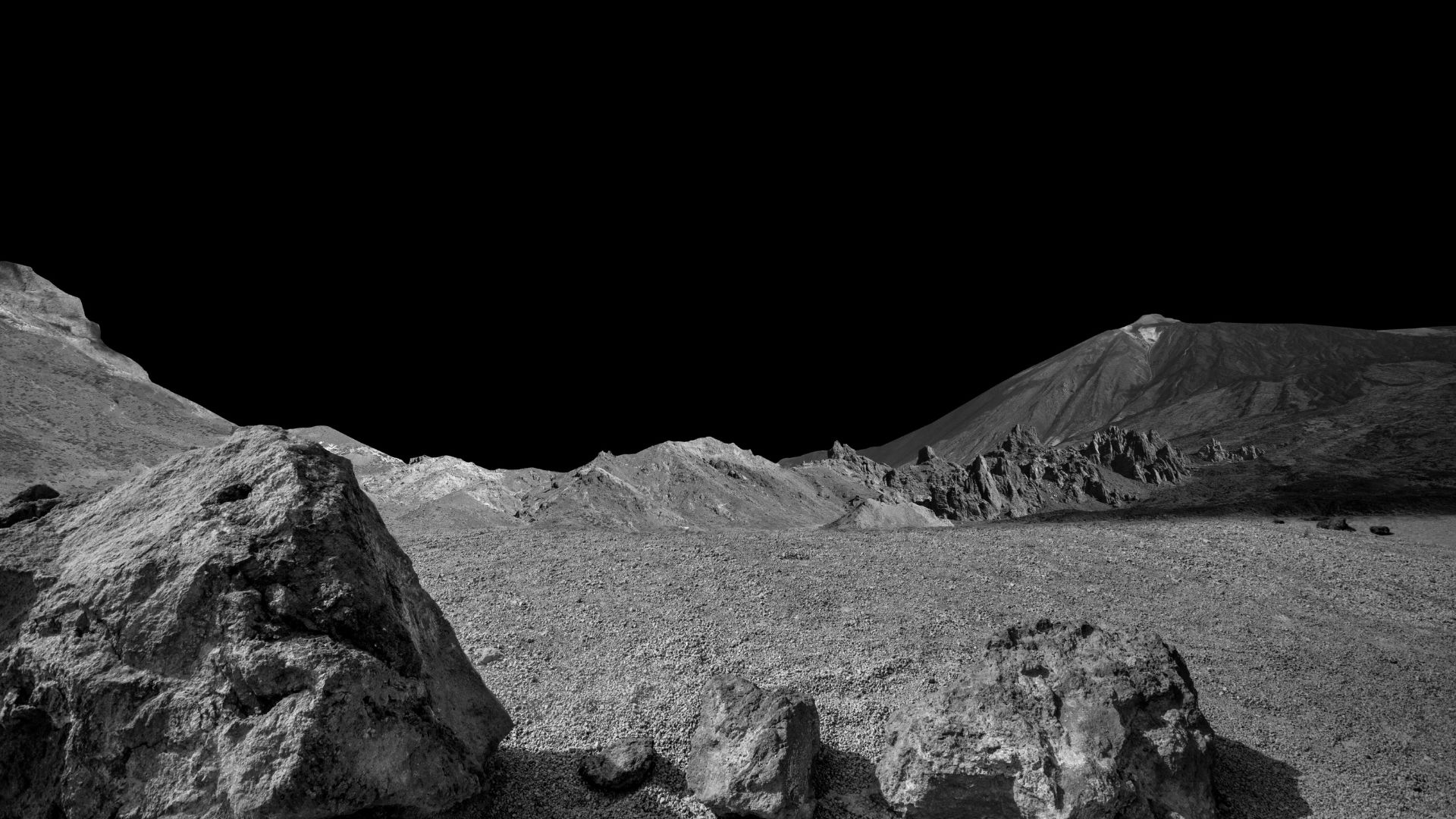 Dark lunar plains with rocky ridges and cratered terrain under a black sky