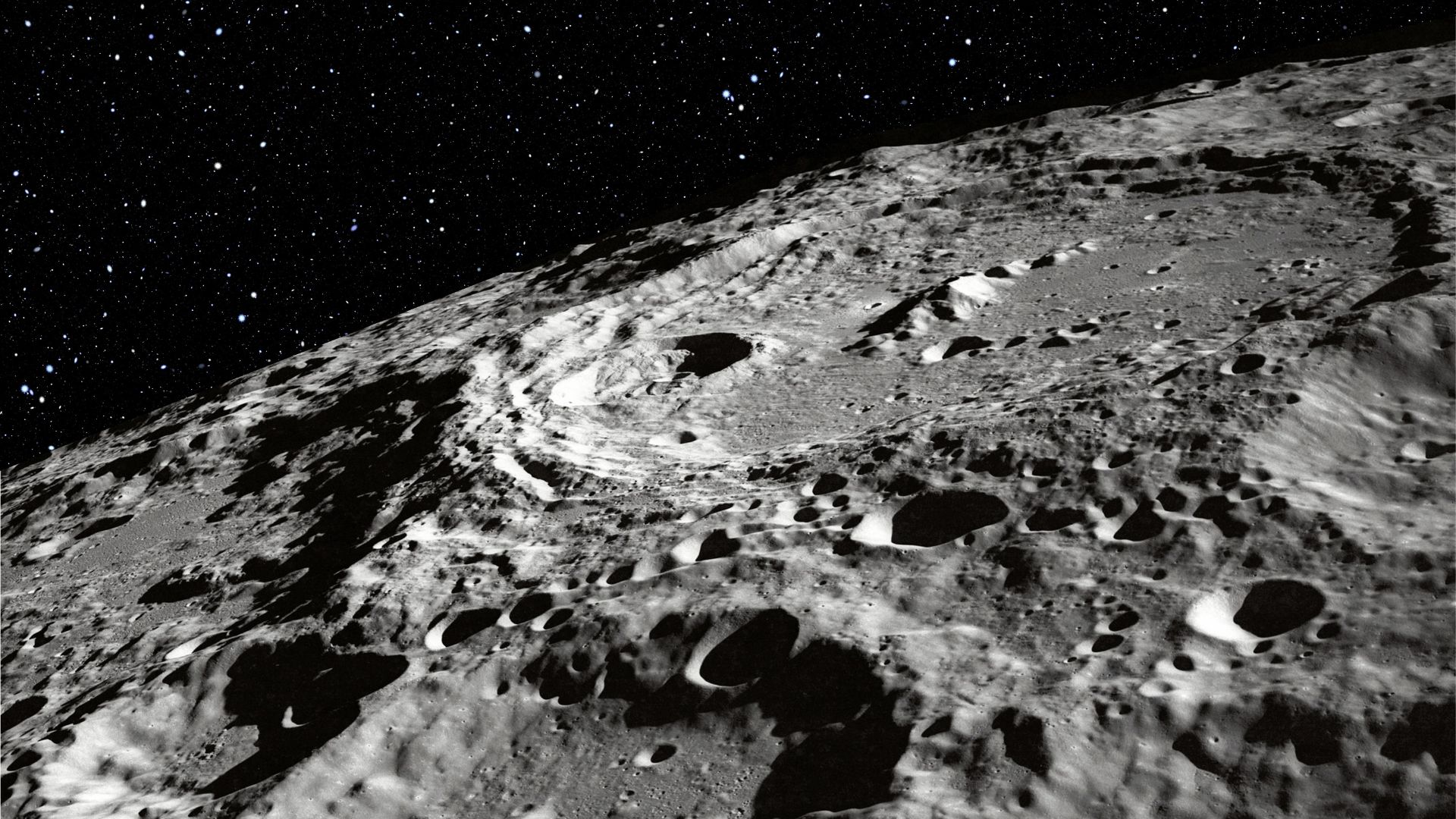 Detailed view of the moon’s surface showing textured ridges and impact craters