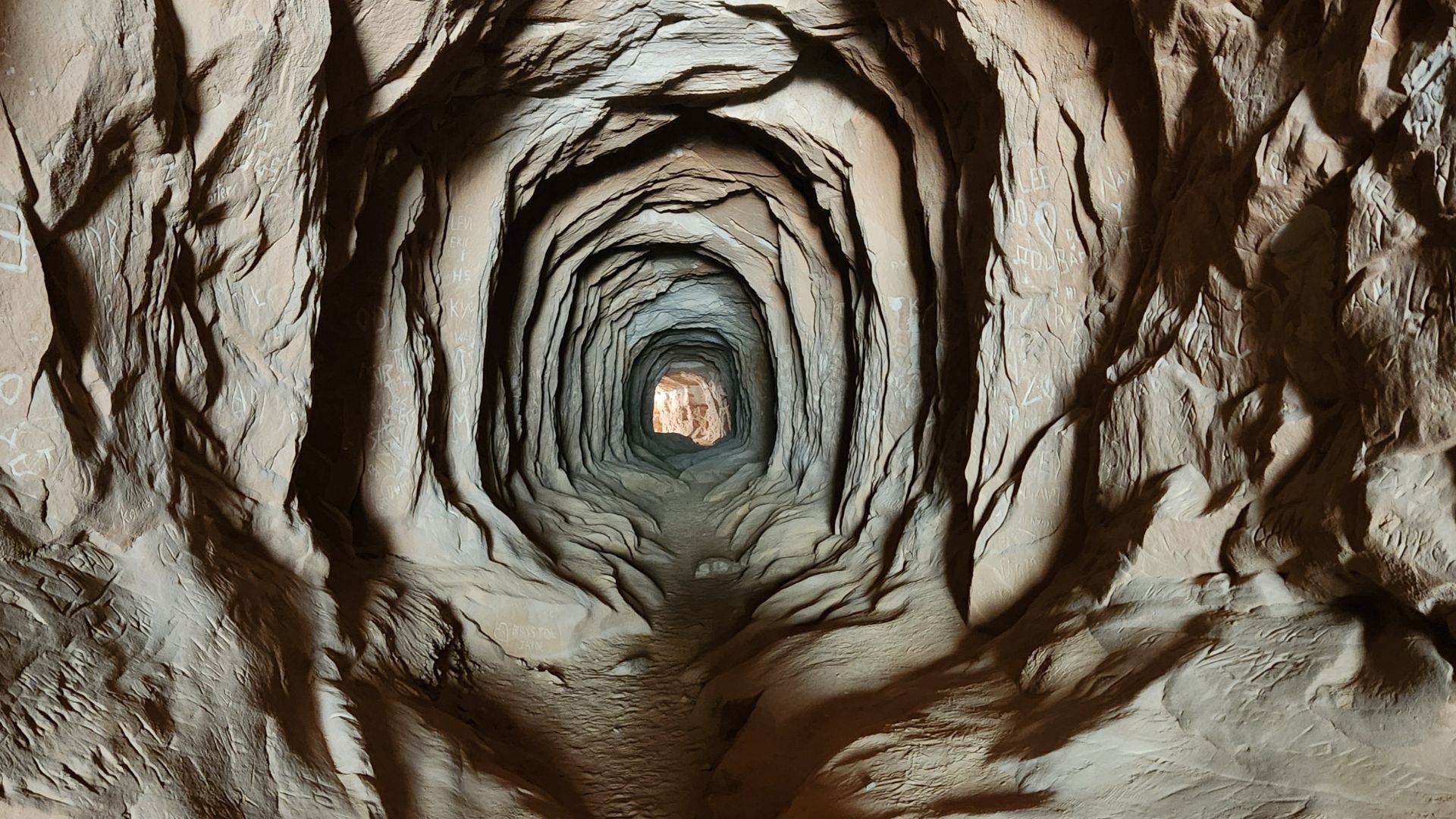 Stratified rock formation near Kanab, Utah showing layered geological deposits