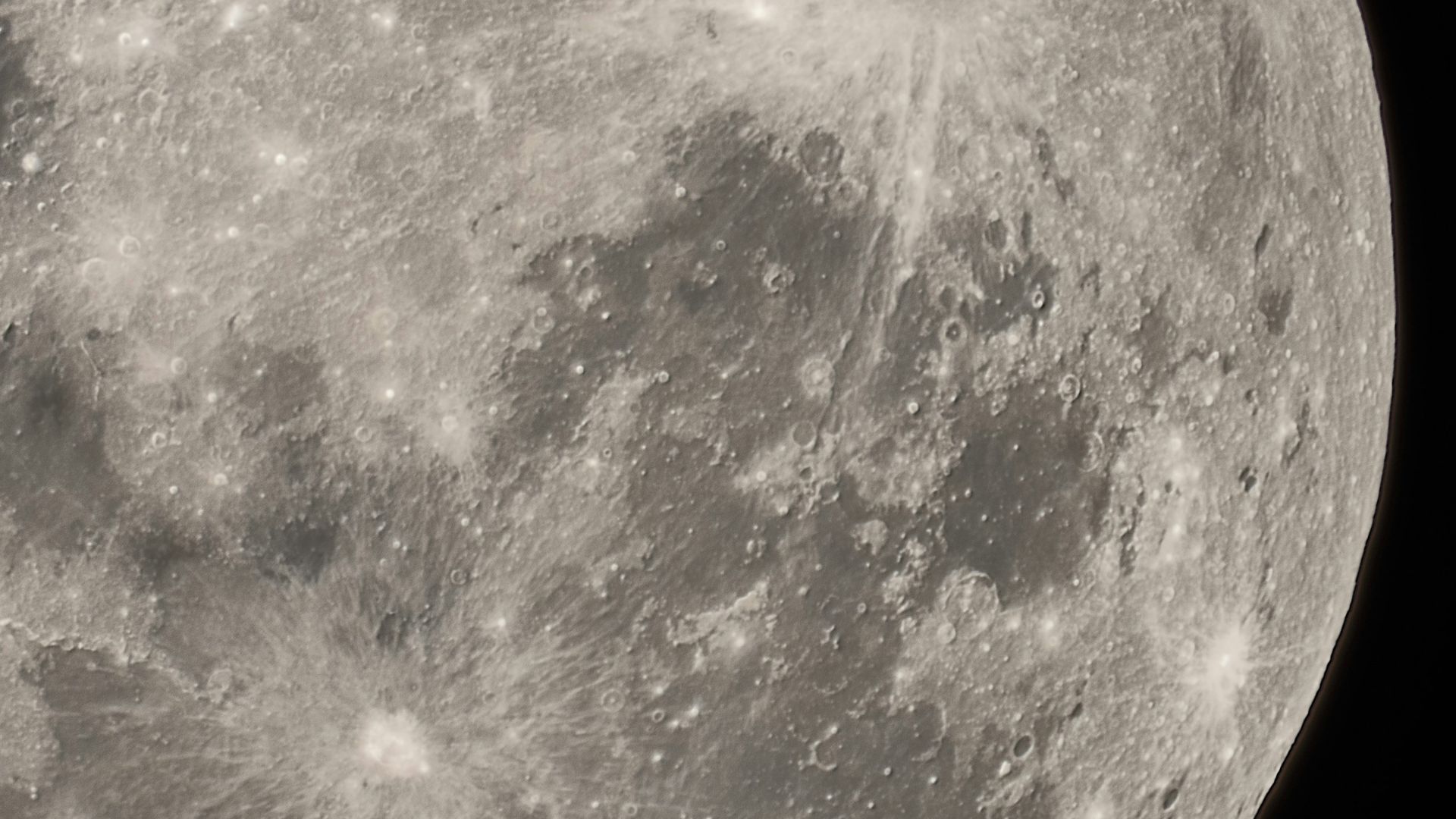 Close textured surface resembling cracked or rippled terrain symbolizing ground movement