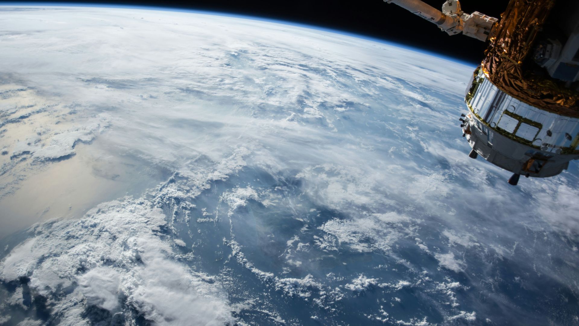 Satellite orbiting Earth with the planet visible in the background