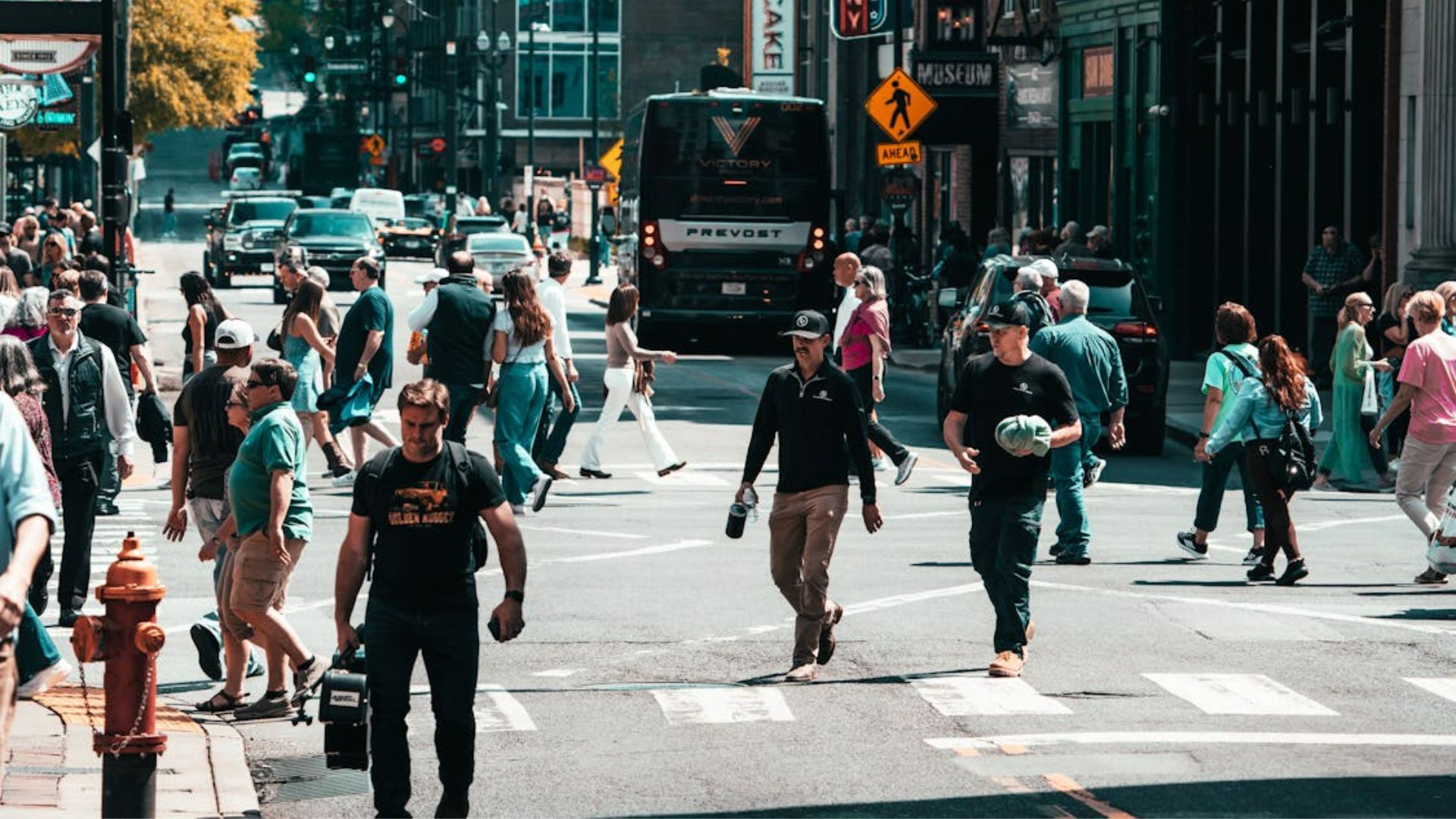 A street scene of a busy city crosswalk
