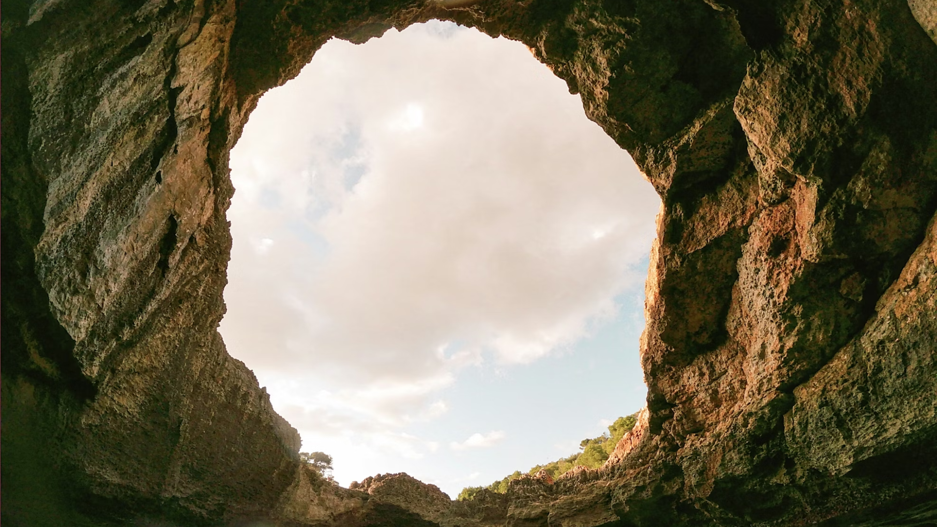 a cave inside perspective looking out