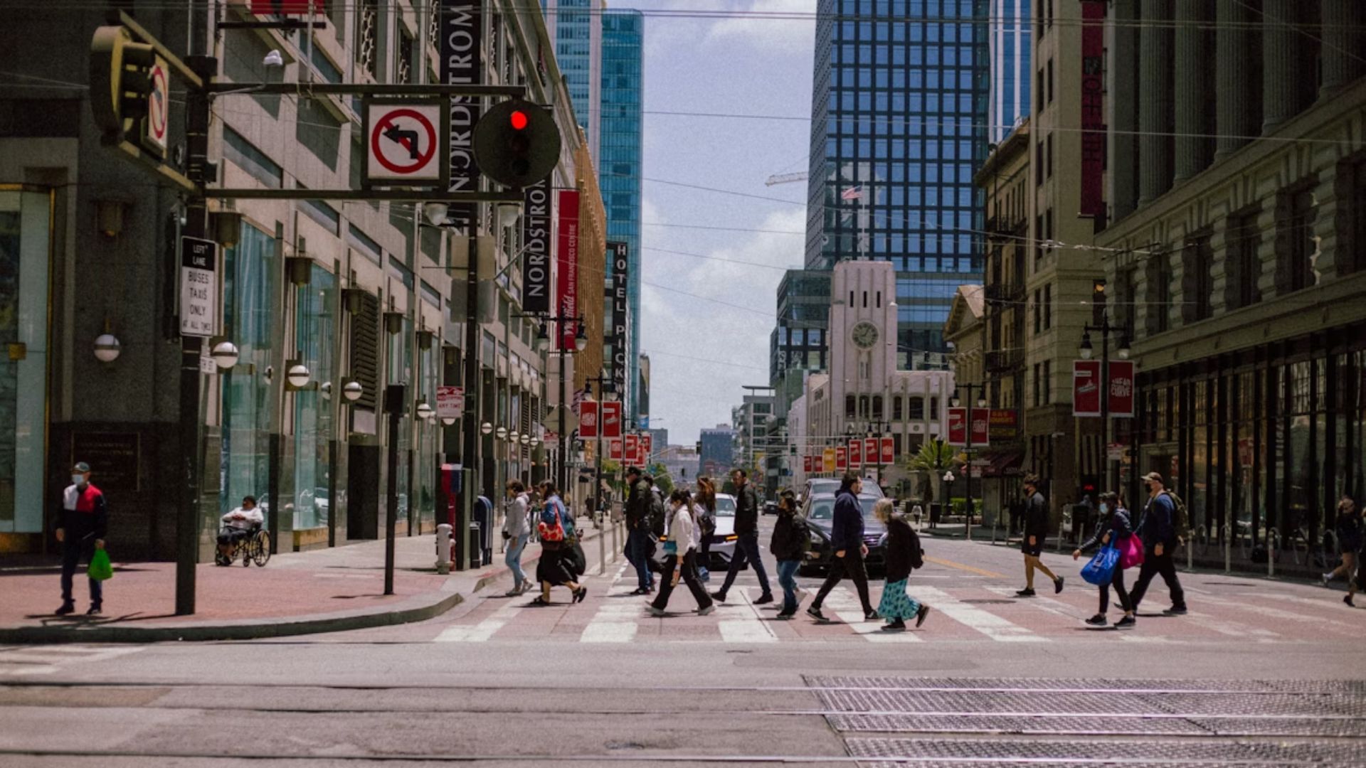 A small crowd crossing the street