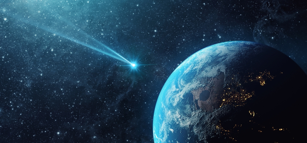 The view of a comet traveling direct to earth from space.