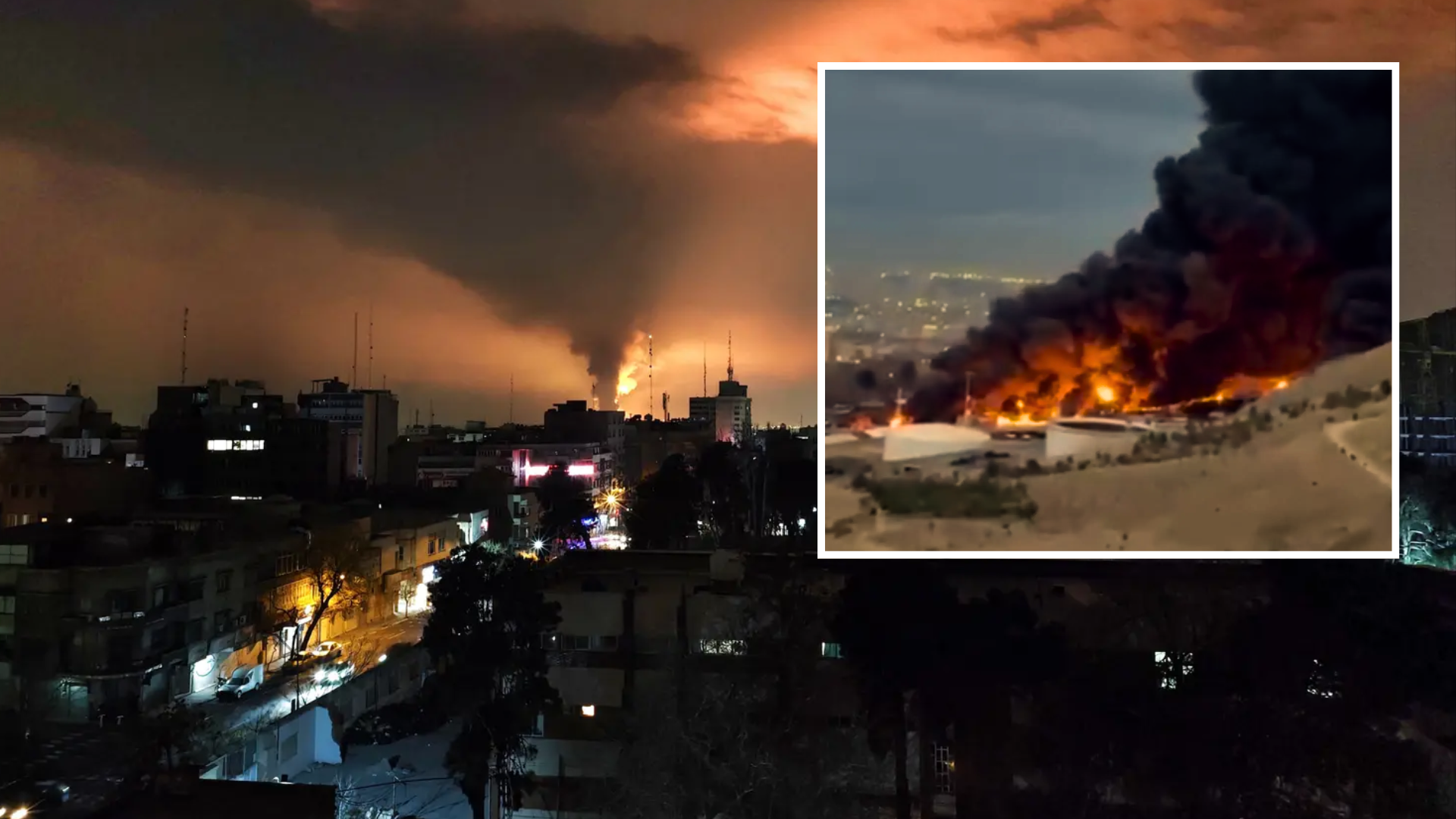 Nighttime view of a city skyline with smoke rising in the distance; an inset image shows a close-up of a massive industrial fire with thick black smoke.