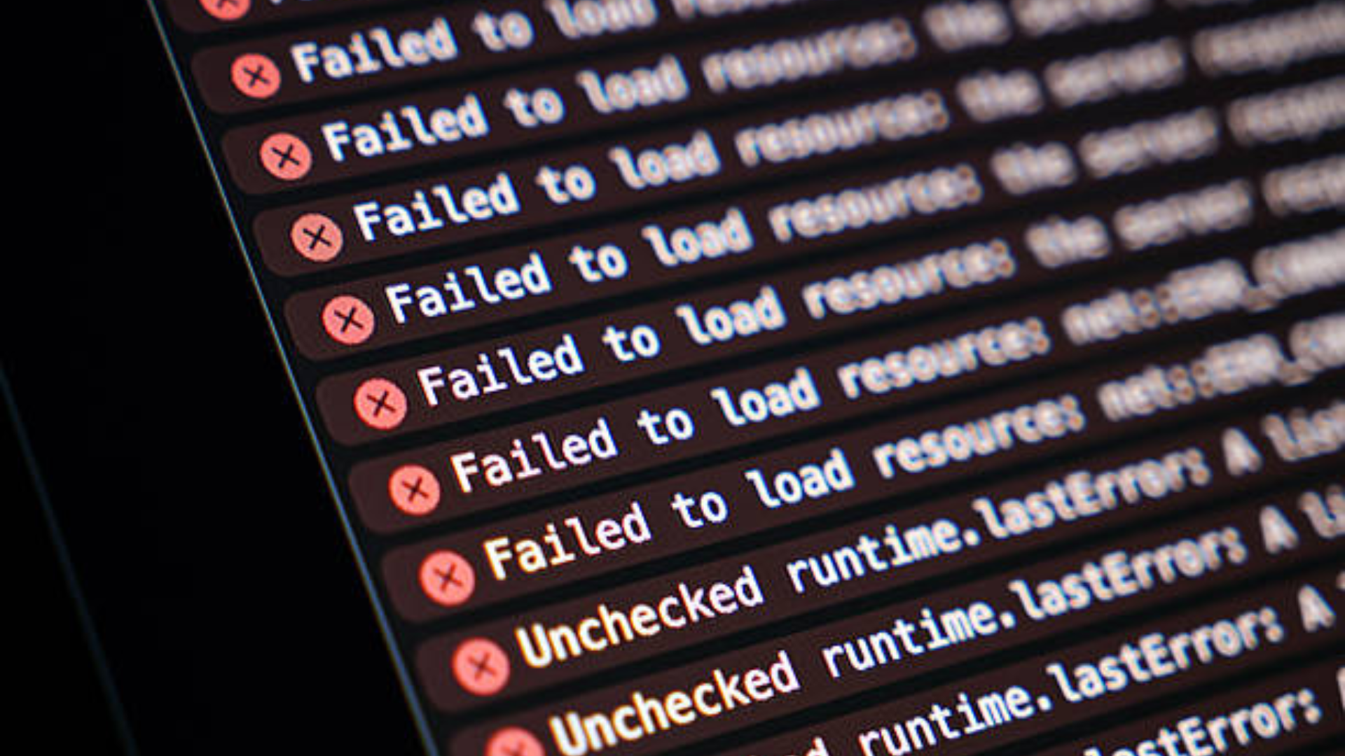 A close-up of a screen displaying multiple red "Failed to load resource" and "Unchecked runtime" error messages in code.
