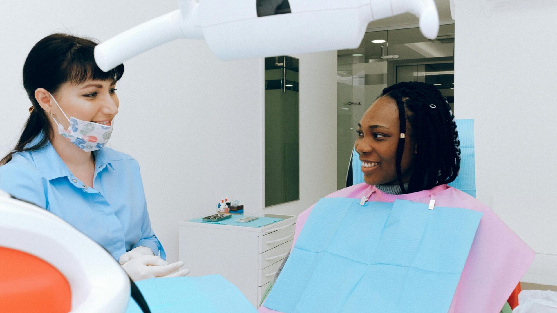 Dentist performing a dental checkup on a patient in a clinic.