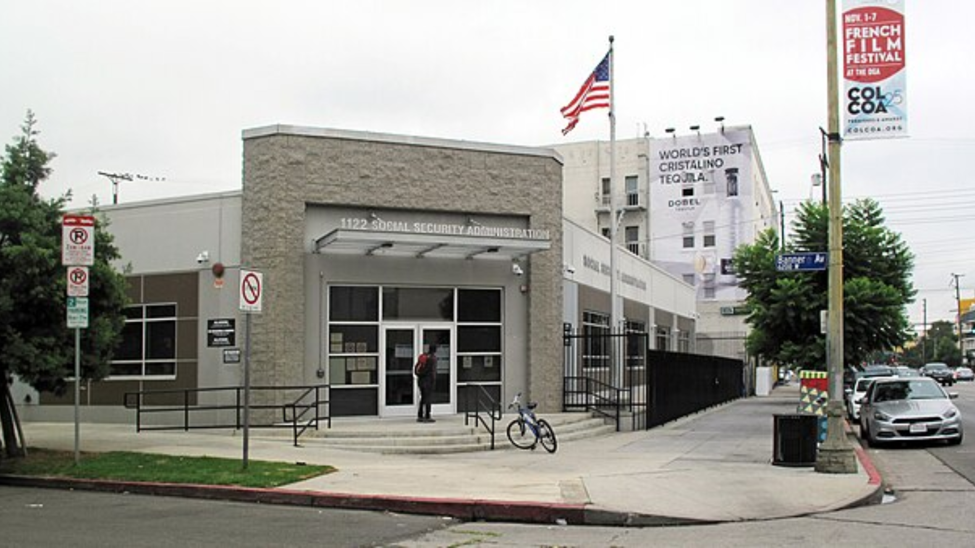 The exterior of a Social Security Administration building located on a city street corner.