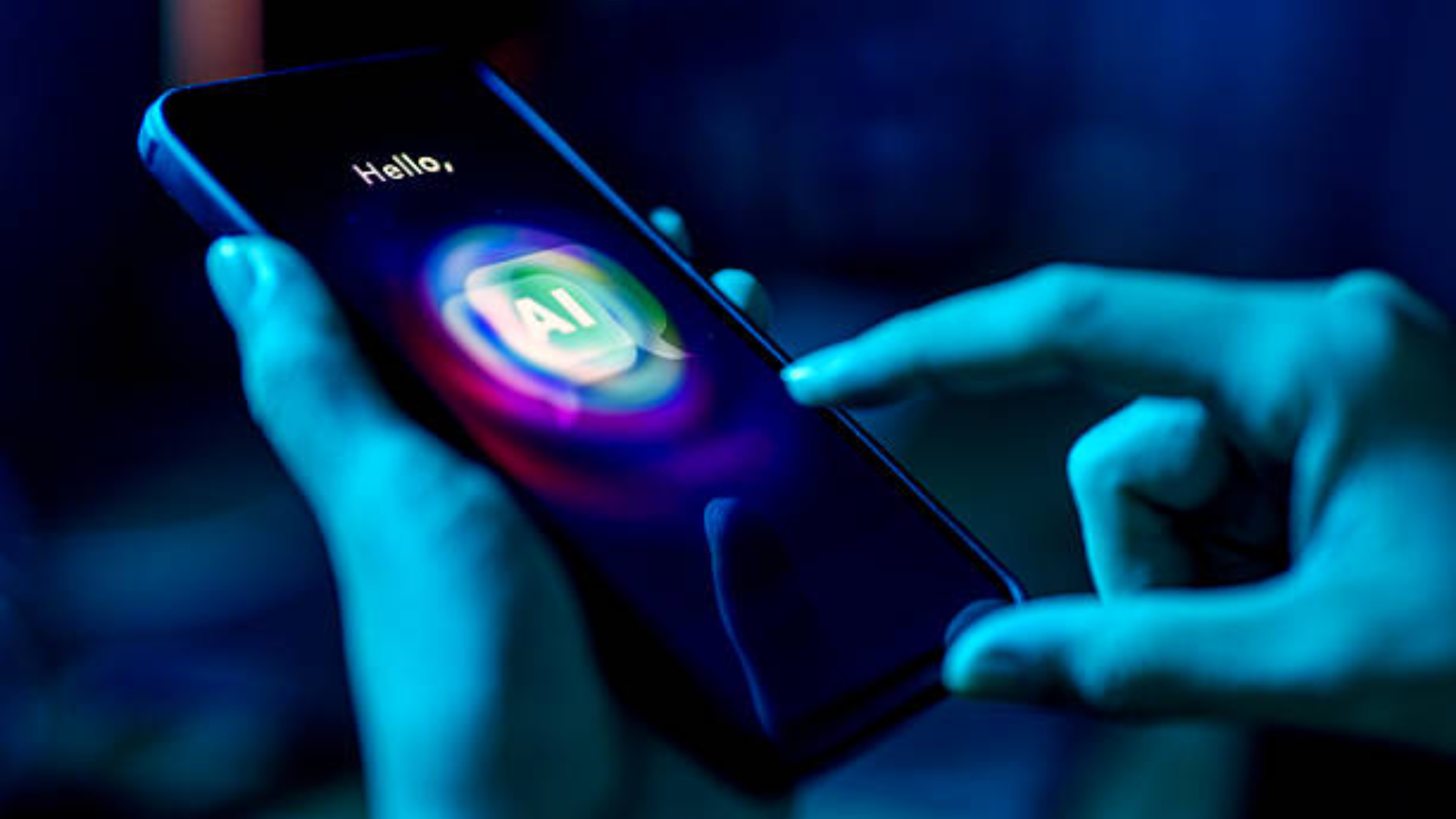 A person holding a smartphone that displays a colorful glowing "AI" icon, illustrating mobile artificial intelligence.