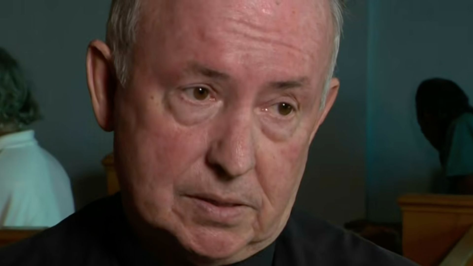 Father Bob Caudill speaking during an interview.