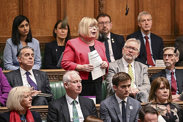 Diane Abbott speaking in the House of Commons as MP Kier Mather sits nearby.