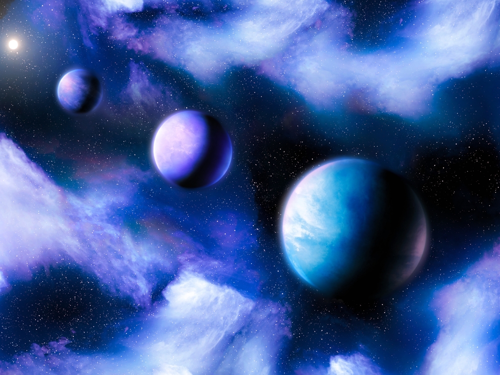 Three exo planets floating among colorful nebula clouds and stars in deep space.