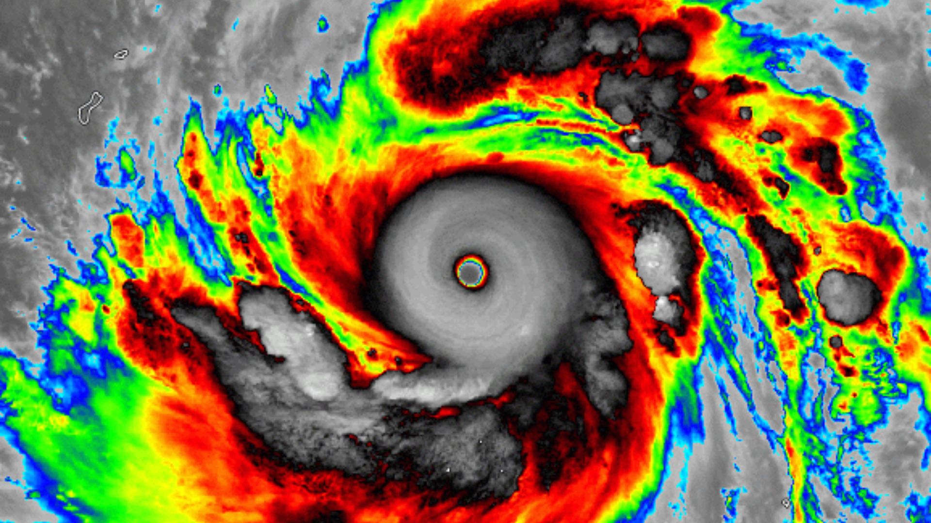 Infrared satellite view of Super Typhoon Sinlaku showing a well-defined eye and intense storm bands over the Pacific.
