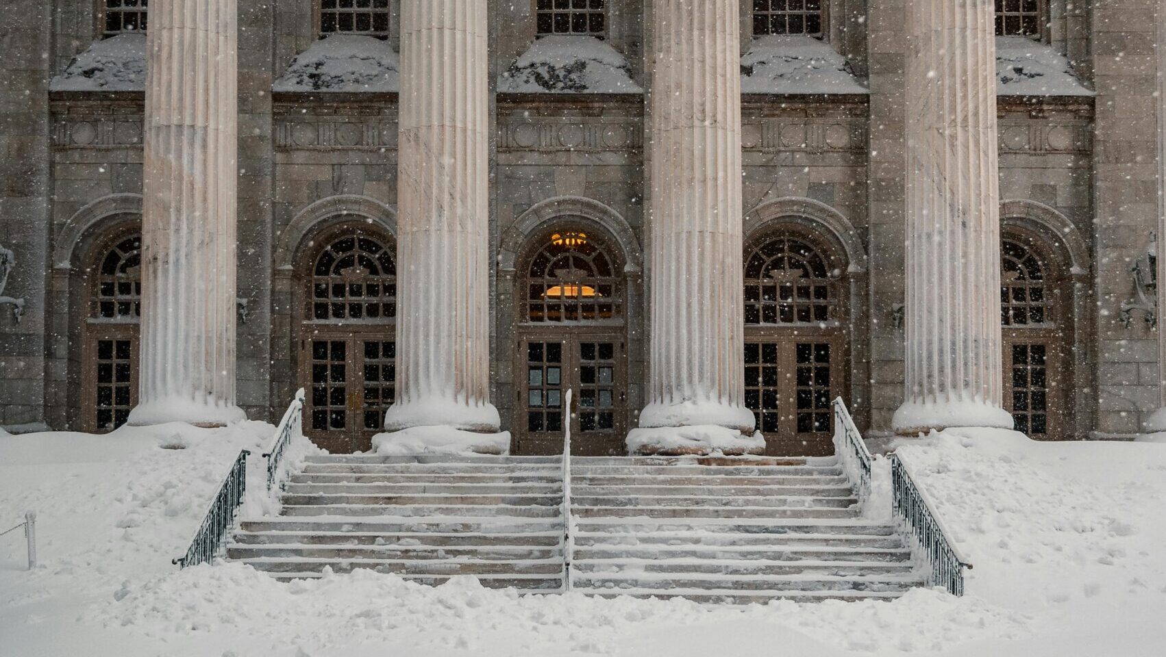 Exterior of courthouse building with tall columns at entrance.