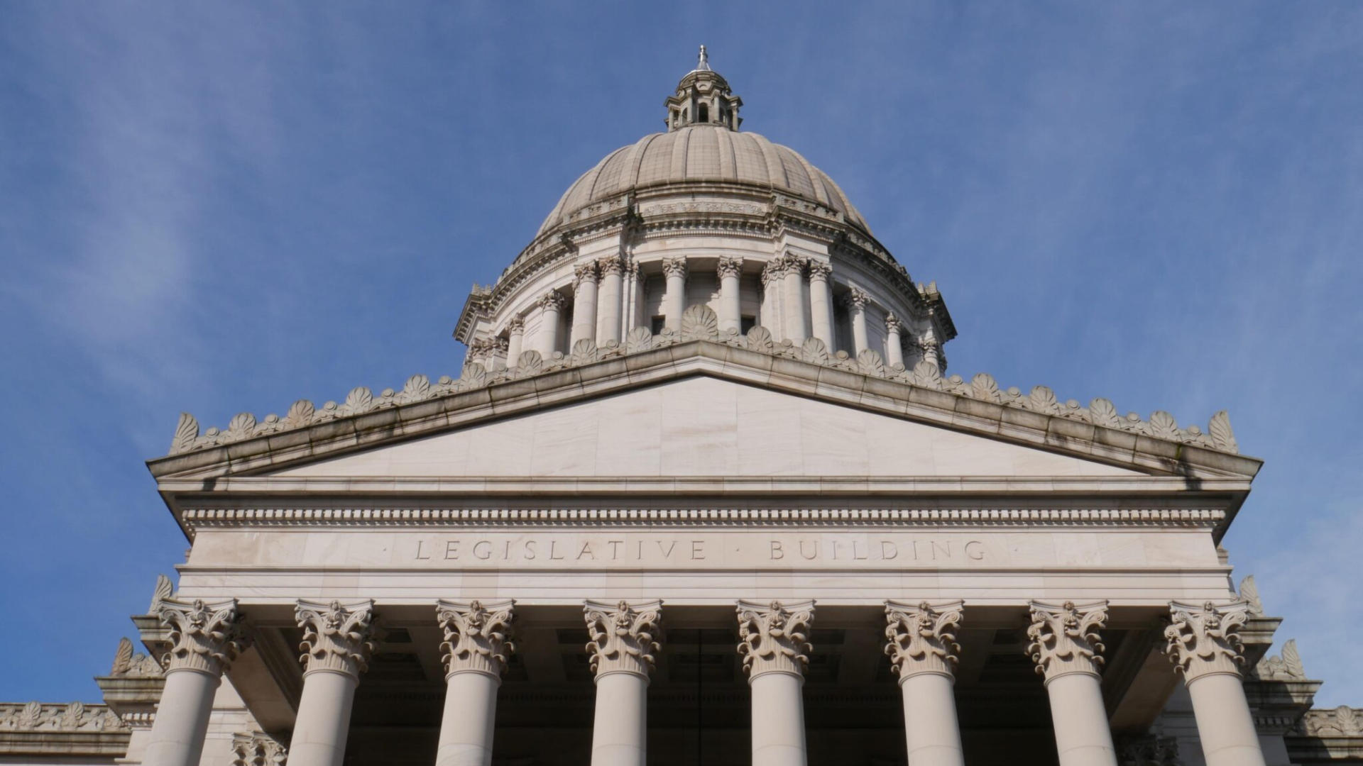 A low-angle architectural shot of the Washington State Legislative Building.