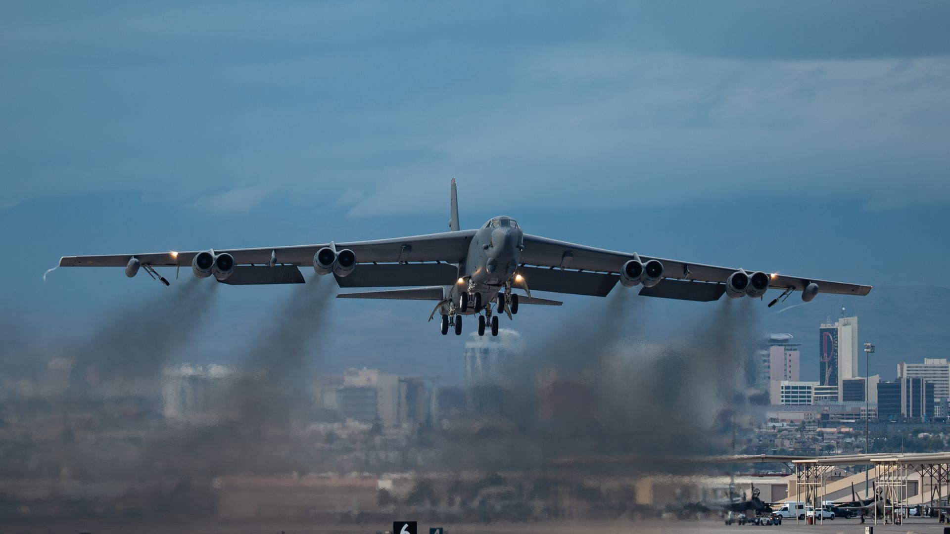 B-52H Stratofortress taking off at Barksdale Air Force Base Louisiana with engine exhaust trailing.