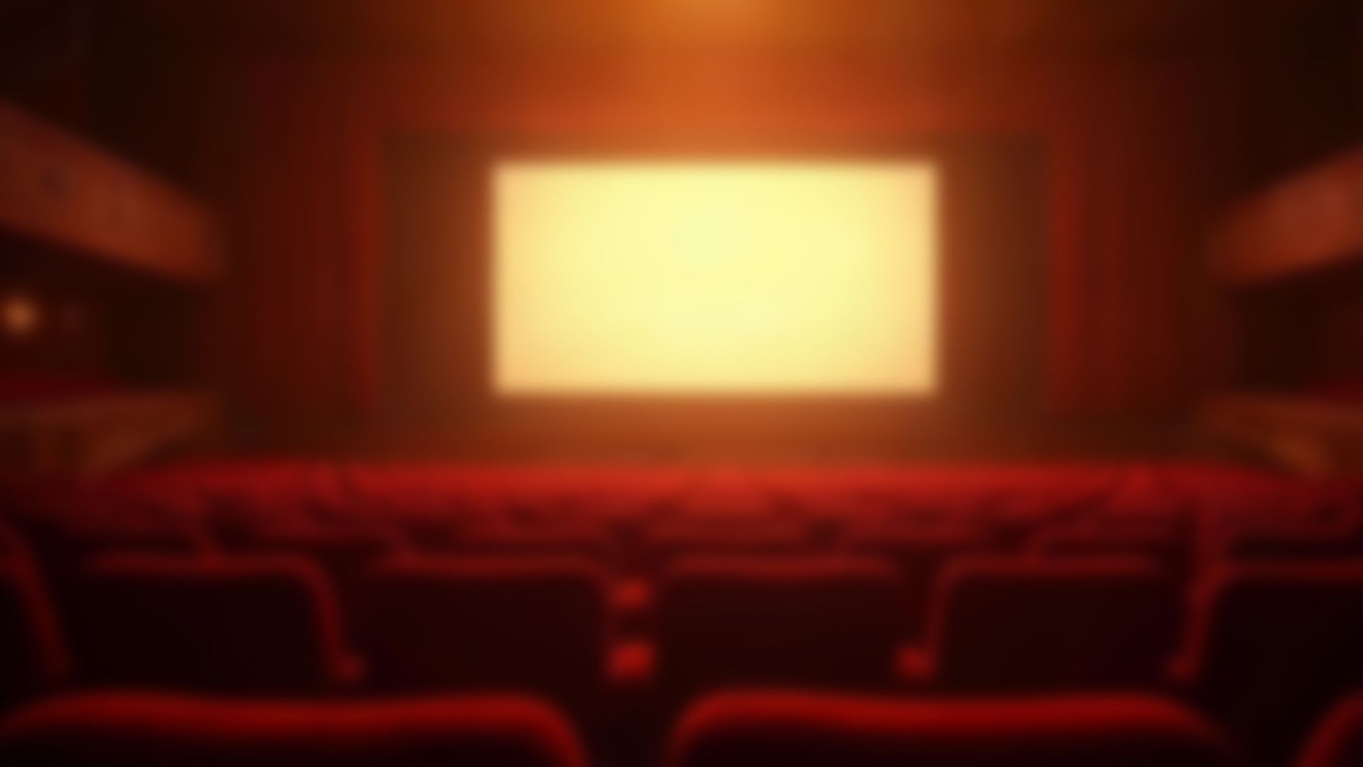 The view of a big movie screen from the seats.