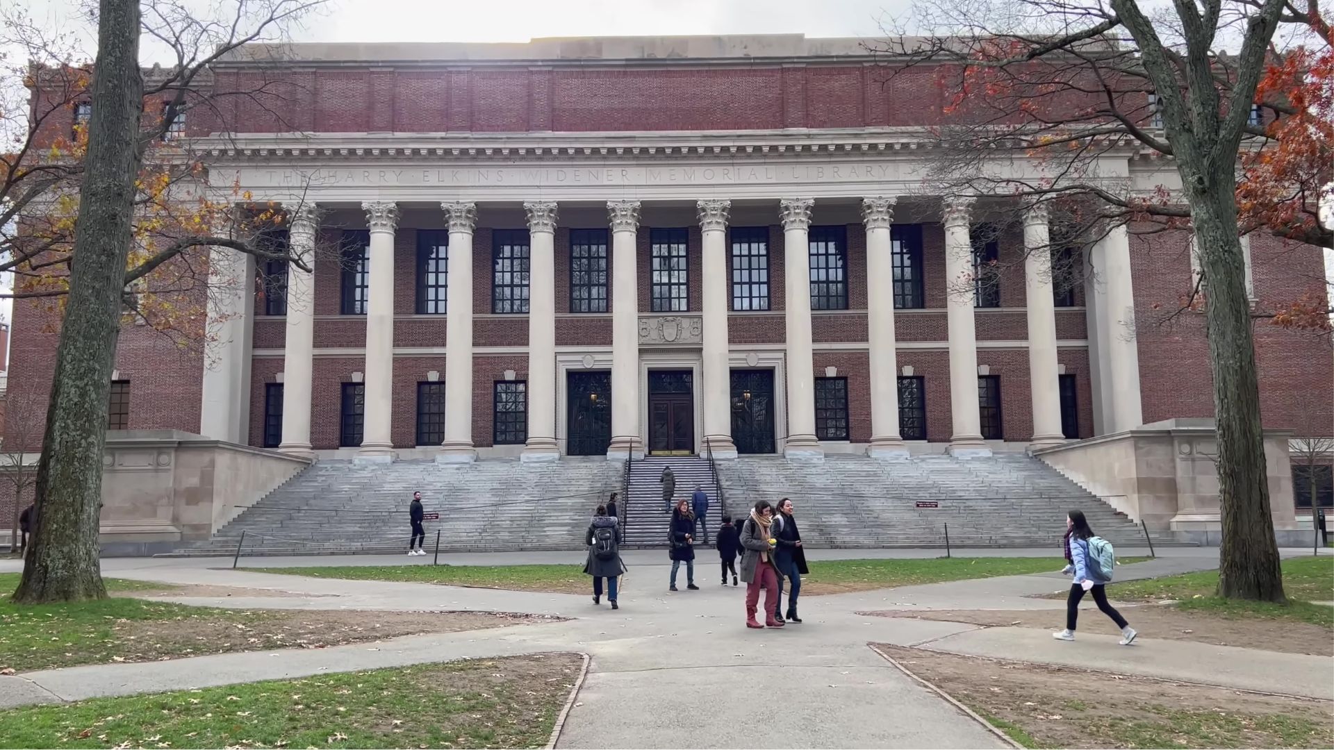 Hardvard students in front of the harvard building.