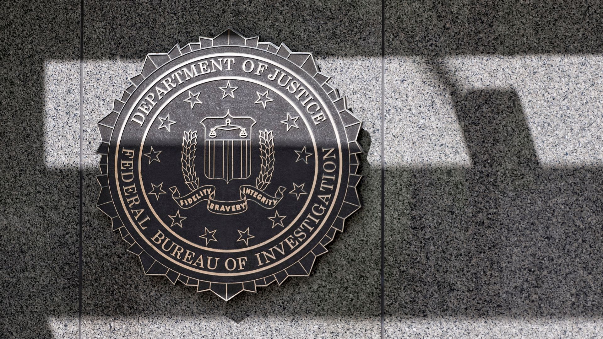 Seal of the FBI on a granite wall in Washington DC.