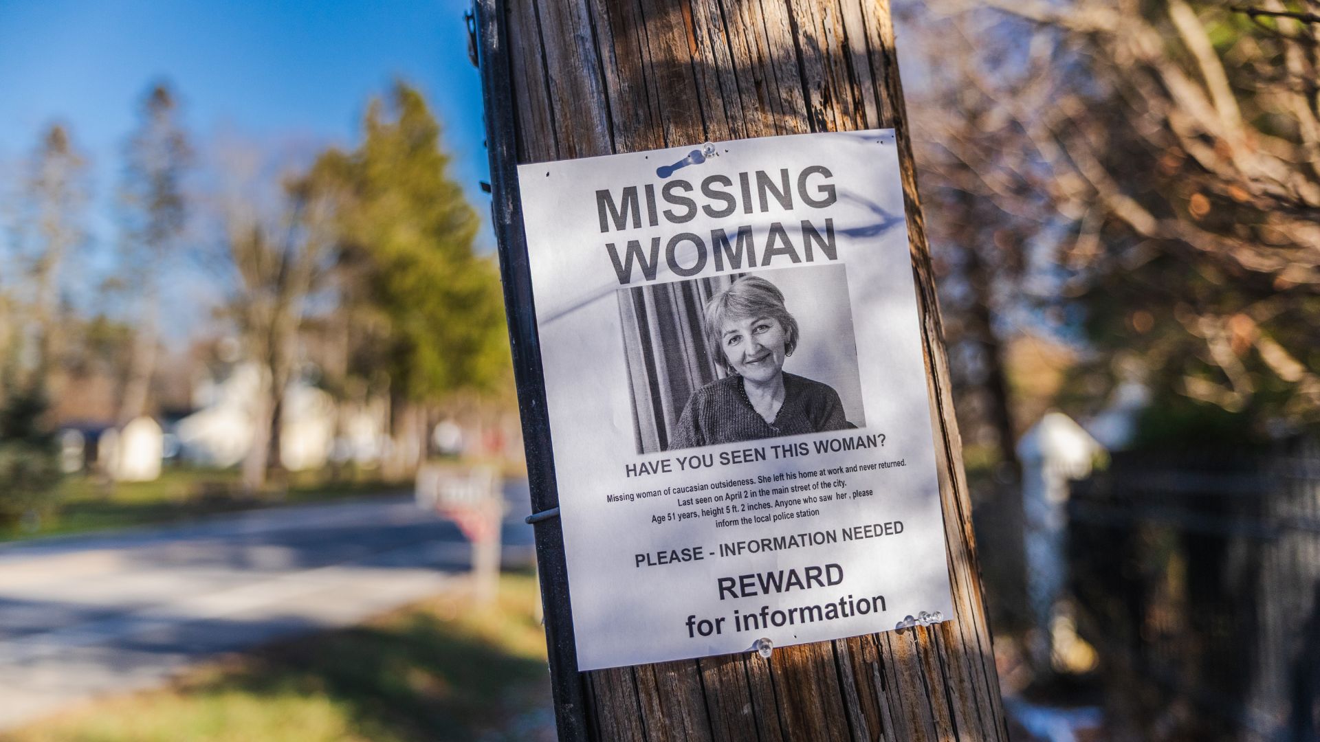 Missing person flyer on a utility pole shown for illustrative purposes only and does not depict anyone referenced in this article.
