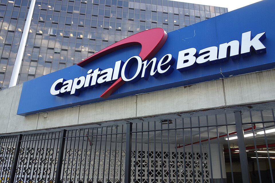 Capital One Bank sign displayed on building exterior in an urban setting.