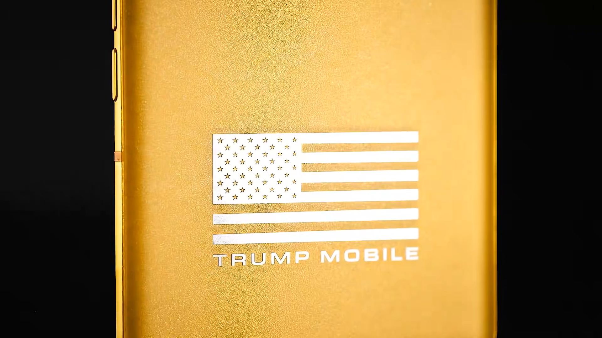 Gold Trump Mobile phone back panel with American flag and branding.