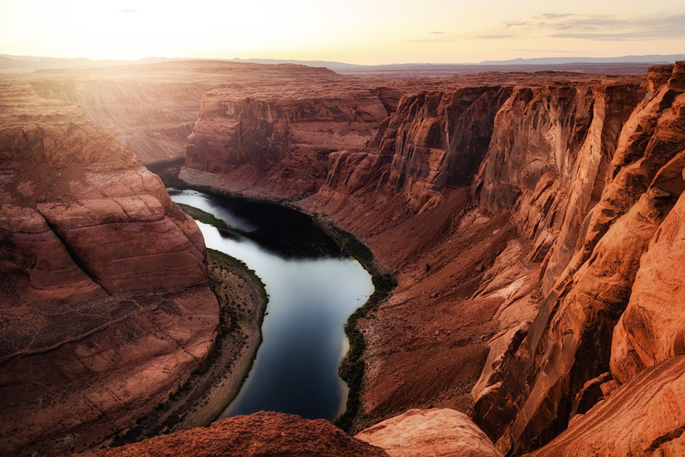 Colorado River winding through steep canyon walls at Horseshoe Bend.