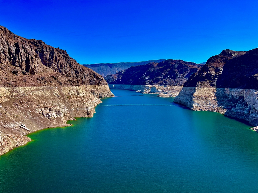 Lake Mead with exposed canyon walls showing declining water levels.