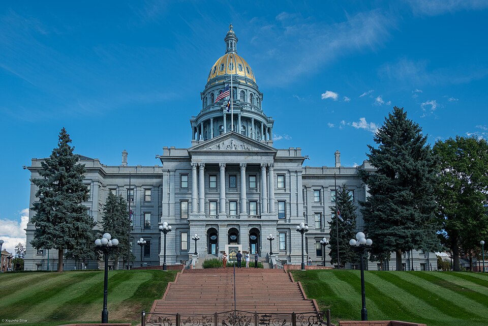 Colorado State Capitol building in Denver under a clear blue sky.