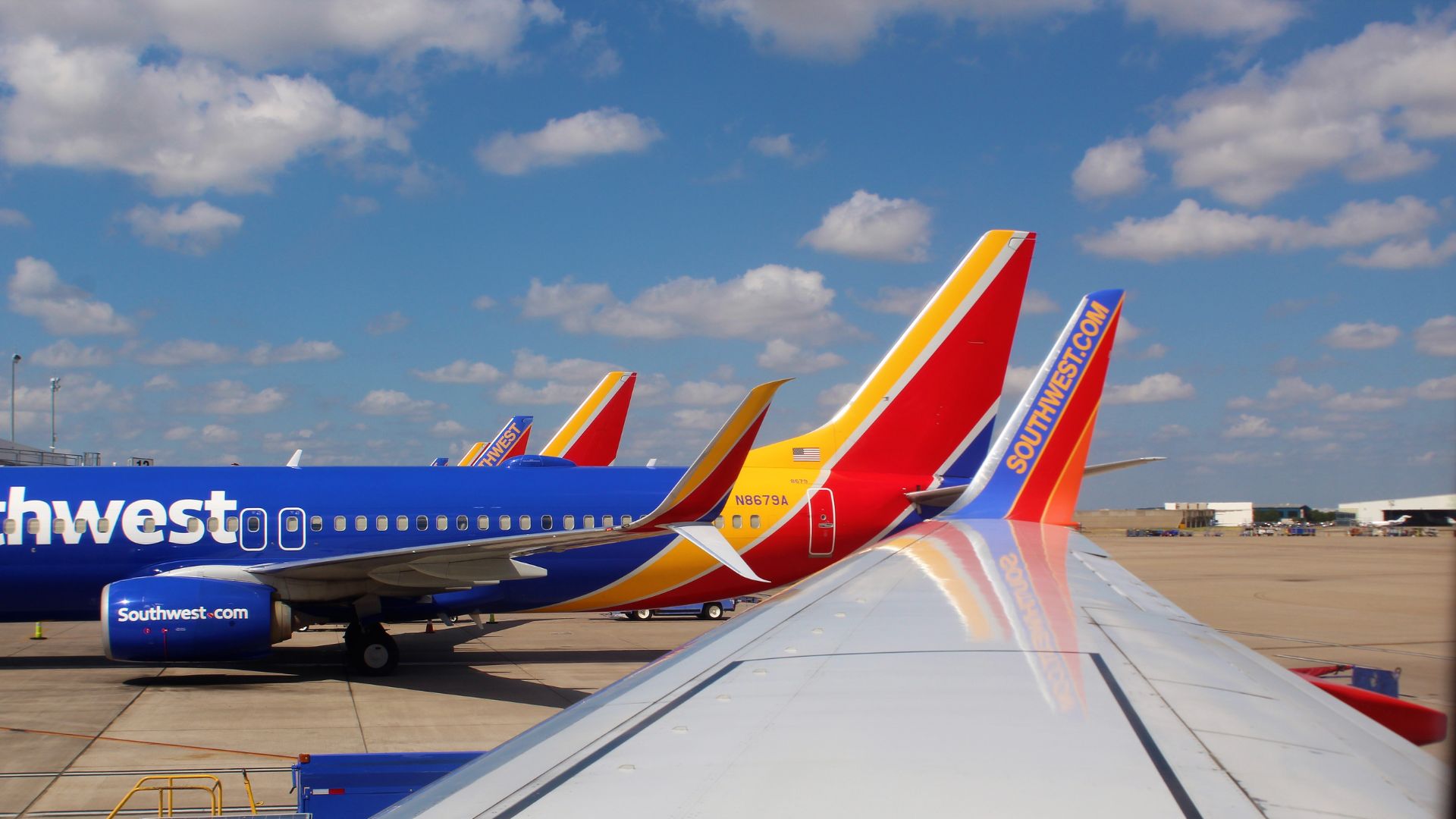 Southwest Airline Planes and a close up of a wing at Love Field Gates.