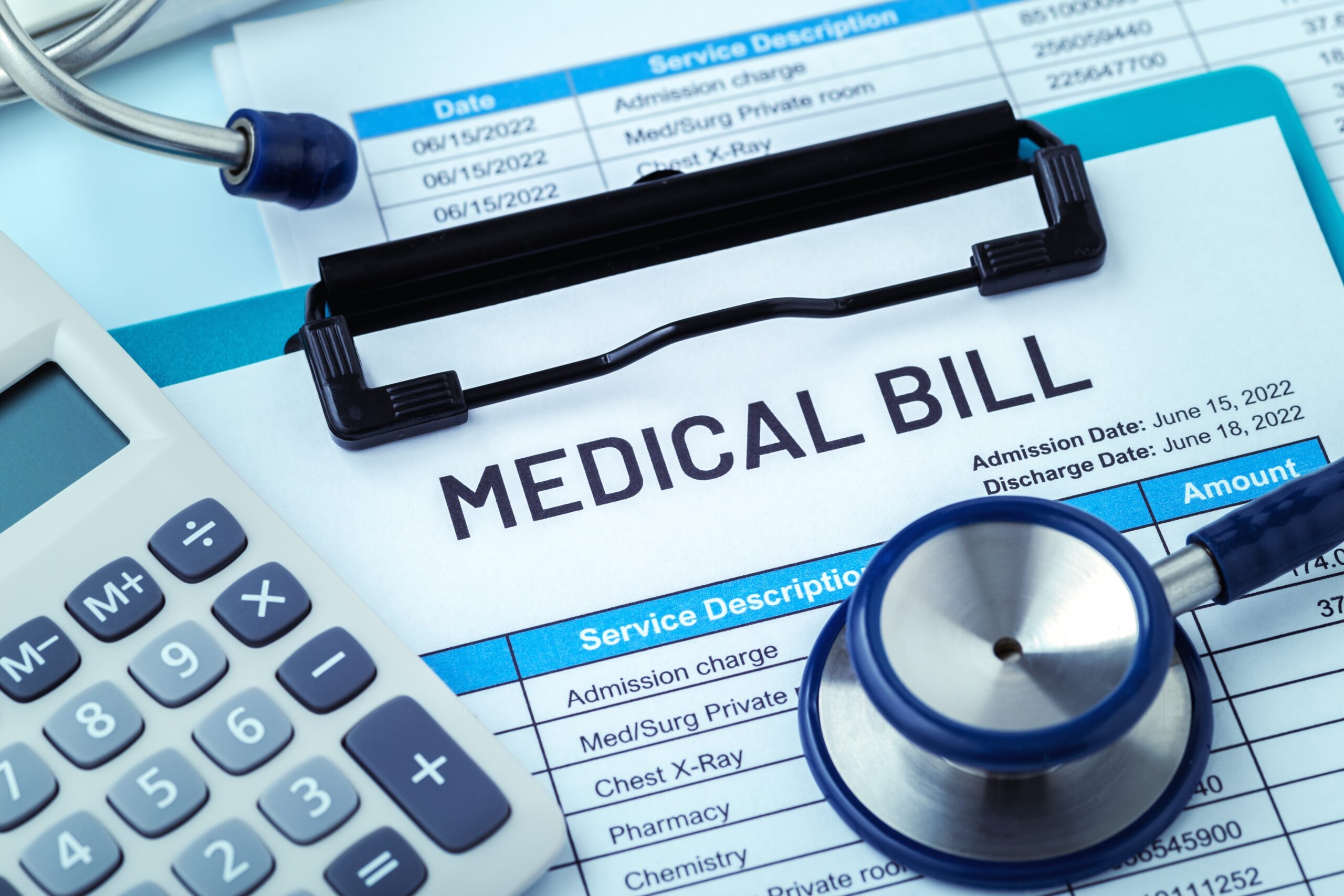 Medical bill, calculator, and stethoscope illustrate rising healthcare costs facing insured Americans.