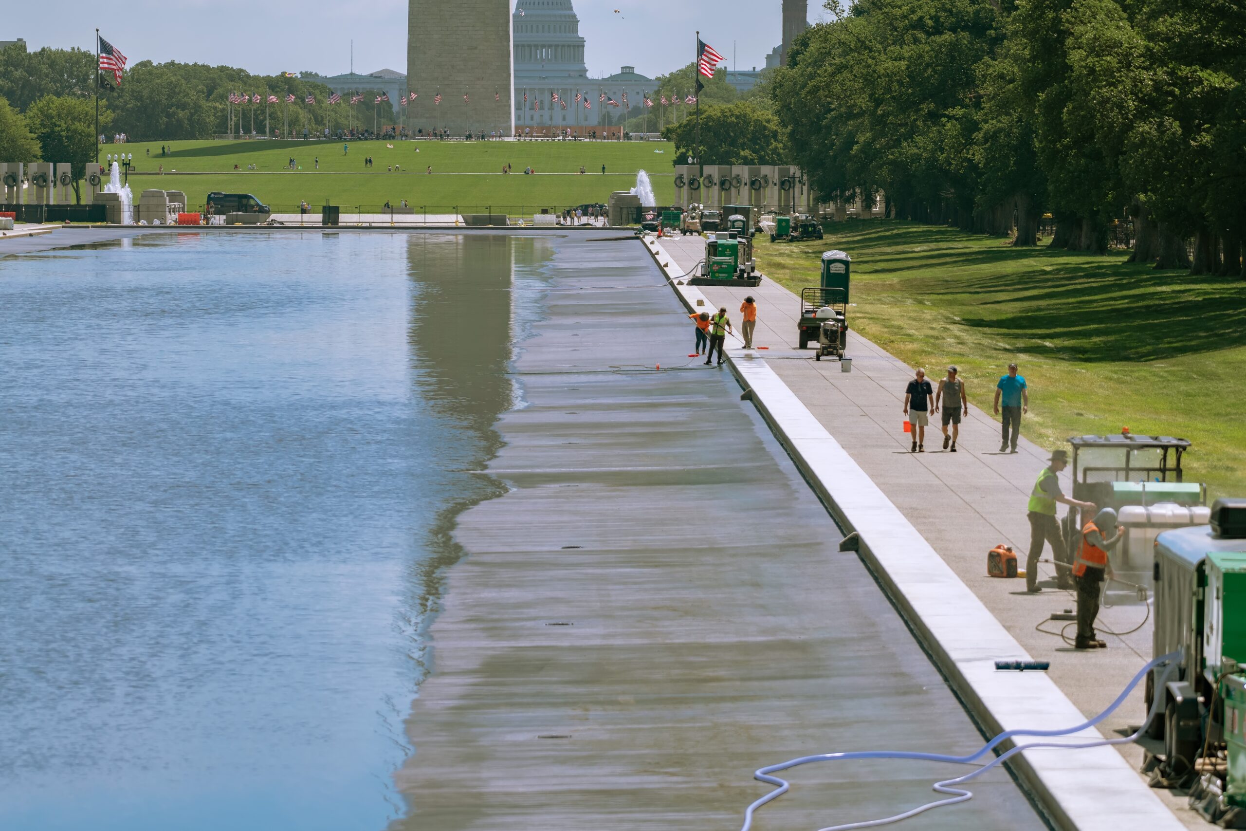 Workers clean and maintain the Reflecting Pool on the National Mall in Washington, D.C.