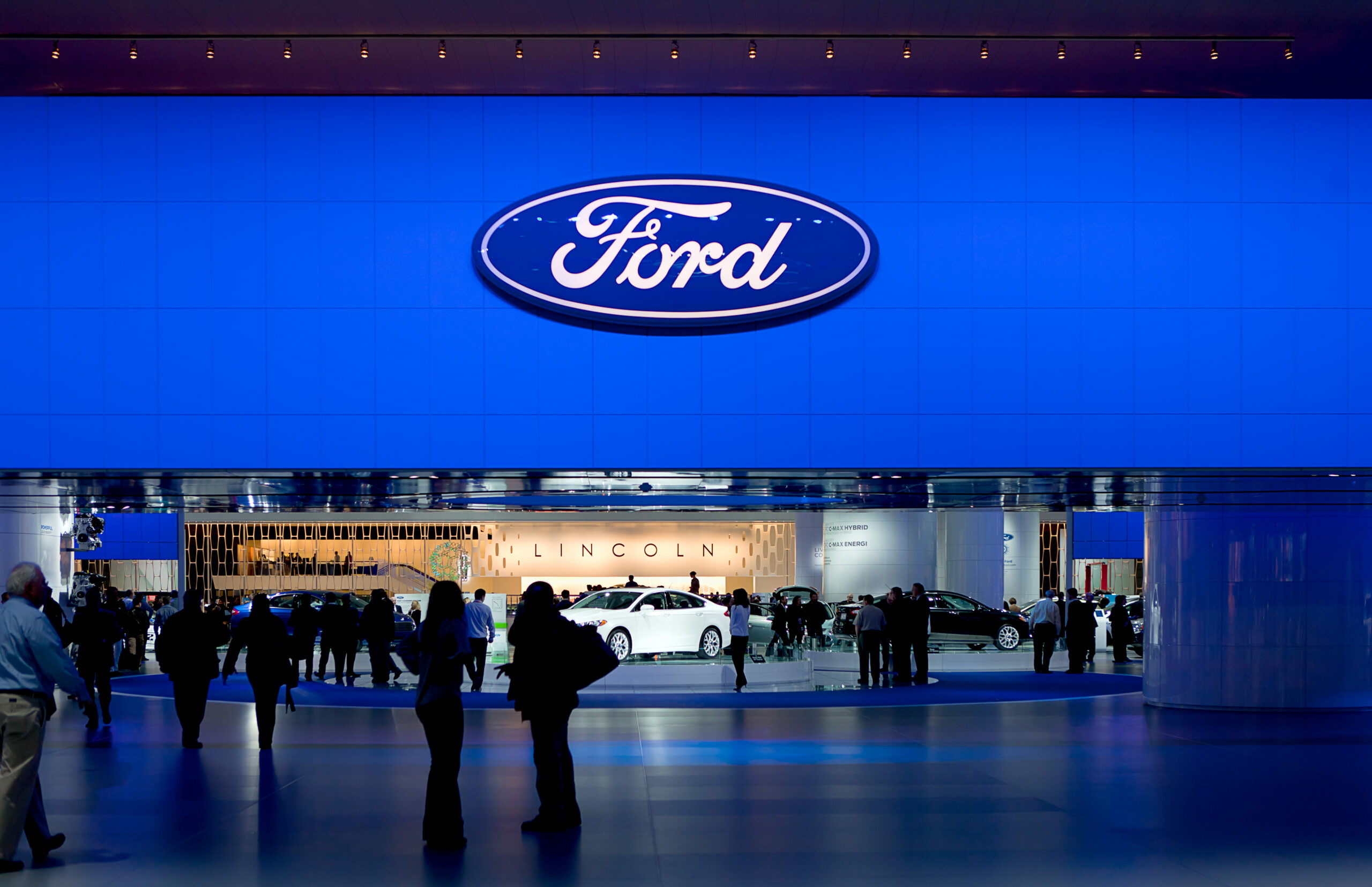 Ford display booth and vehicle showcase at an automotive exhibition.