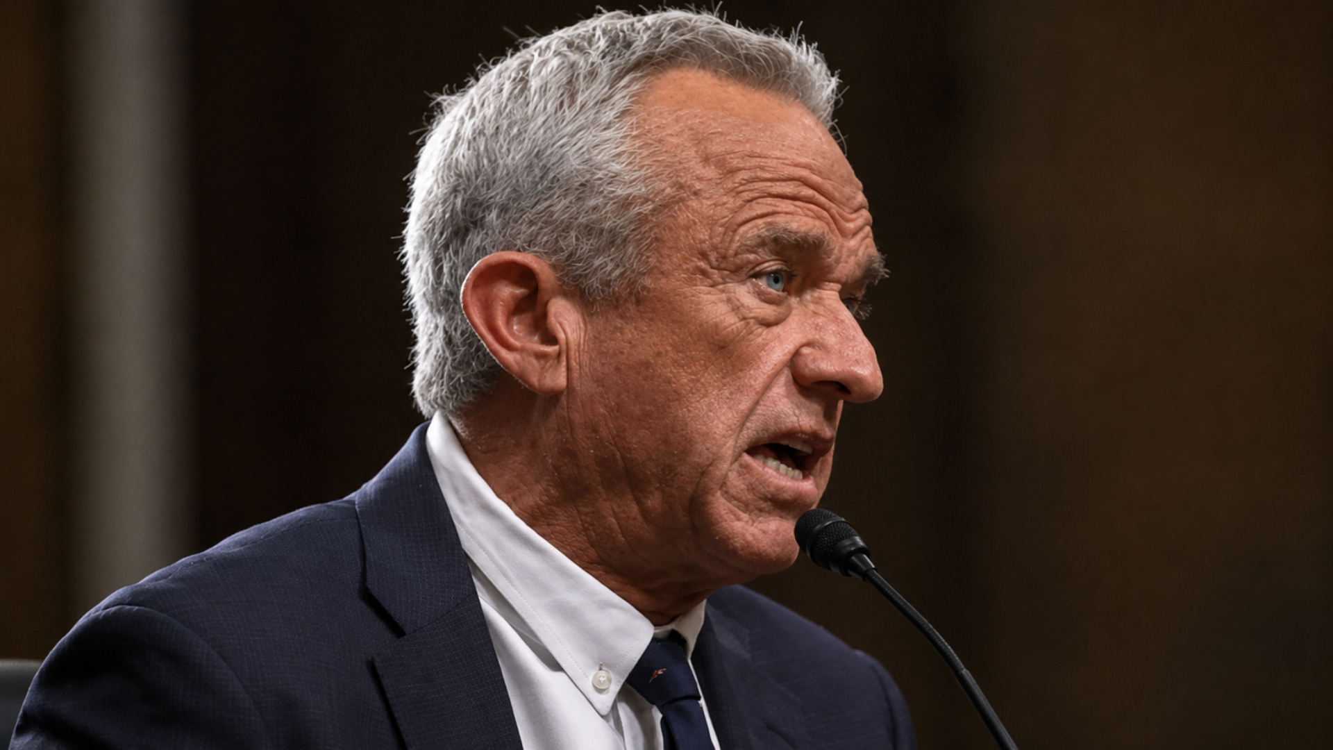 Robert F. Kennedy Jr. testifying at a microphone during a hearing.