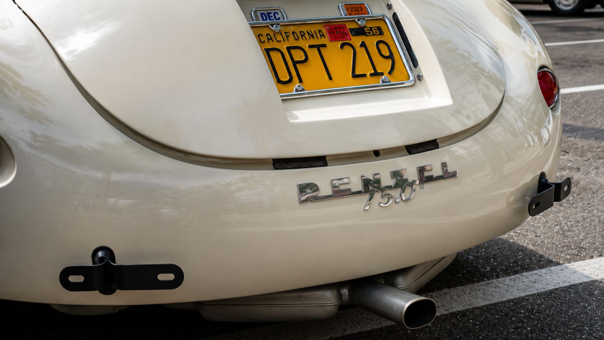 Rear of a classic Renault 750 with a vintage California license plate.