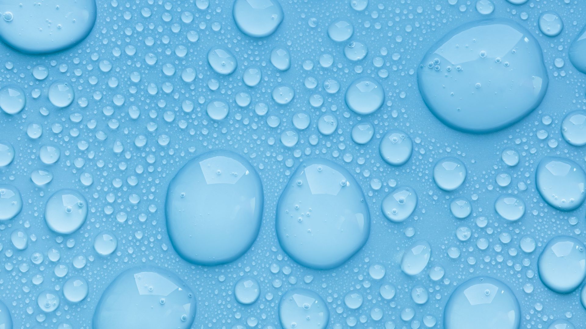 Water droplets on a blue surface.