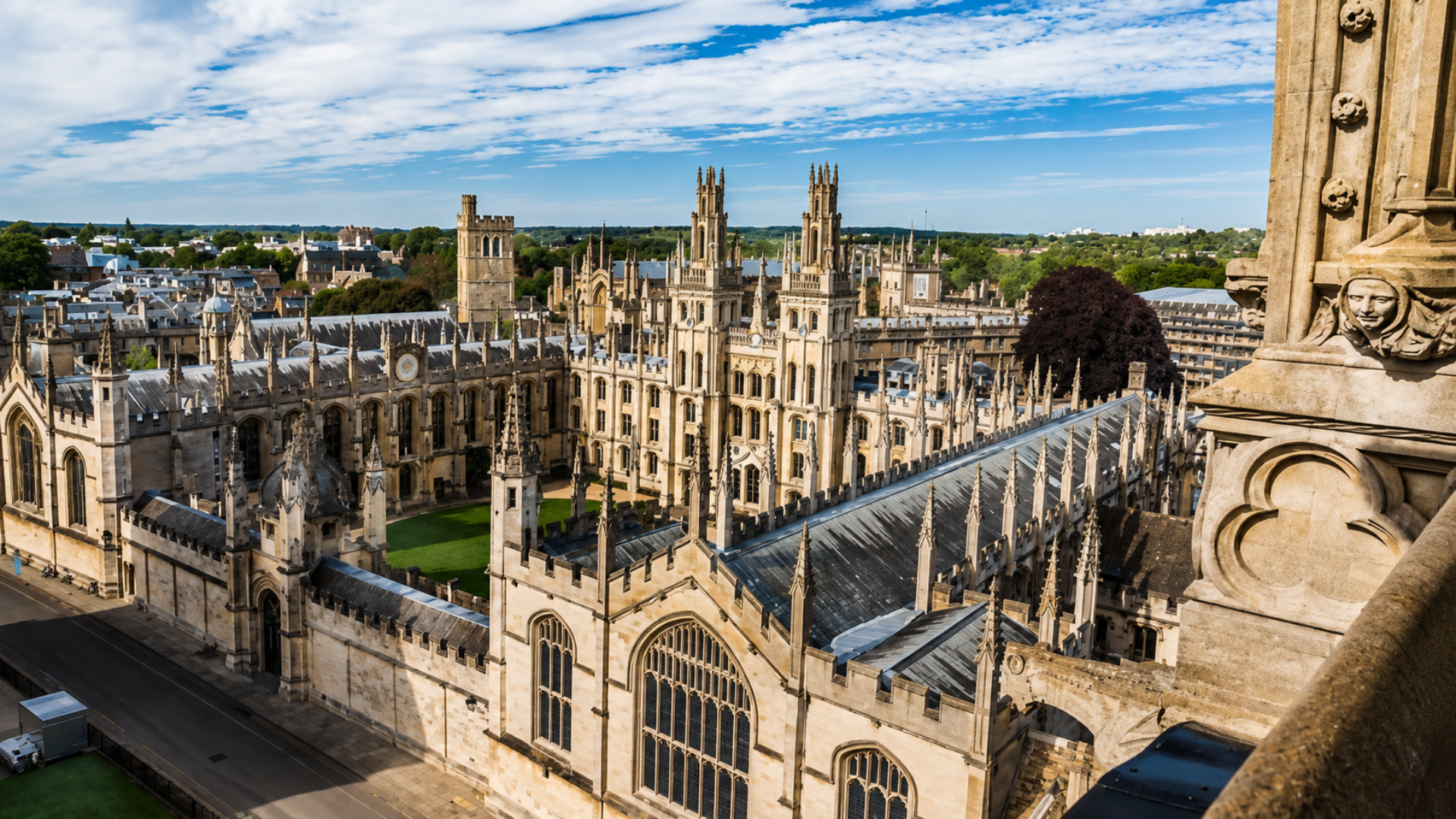 An aerial view of the historic stone buildings and courtyard grounds of Cambridge University.