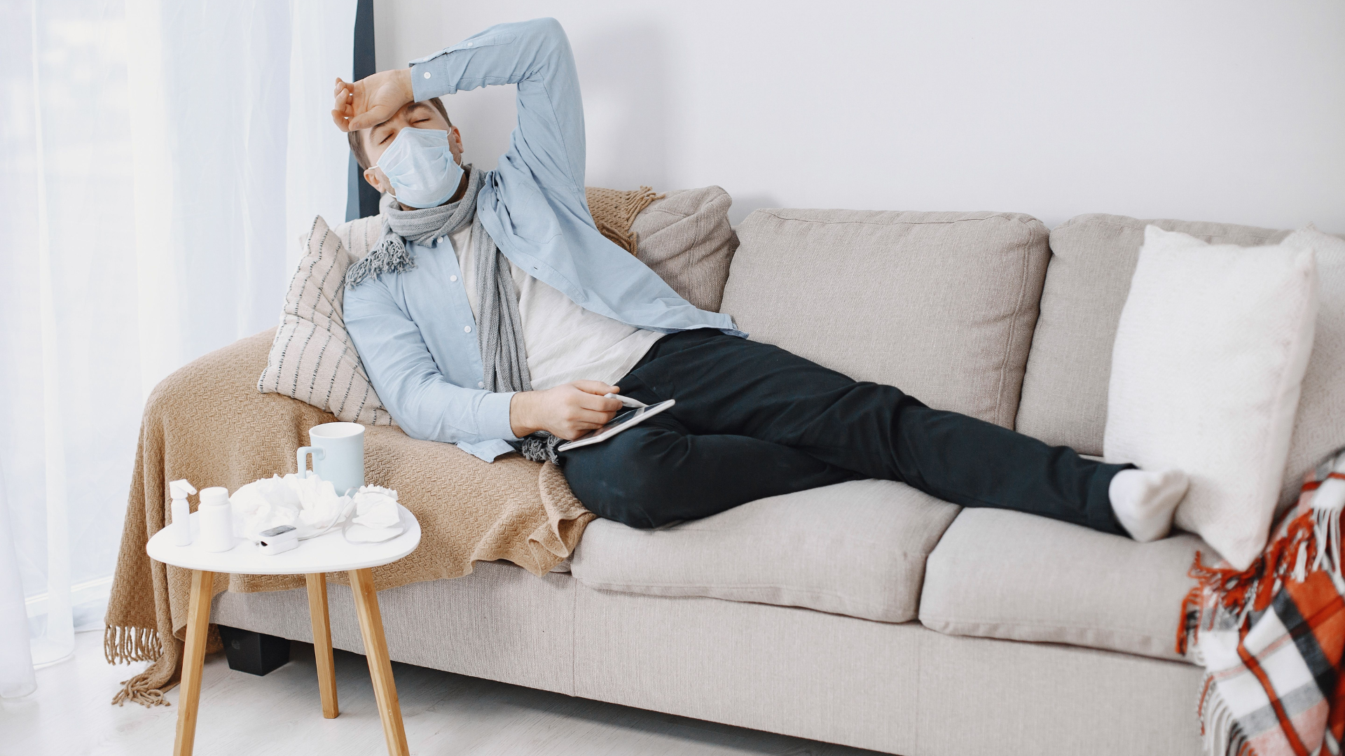 A person coping with cold-like symptoms at home reflects how COVID can be mistaken for an ordinary cold this season.