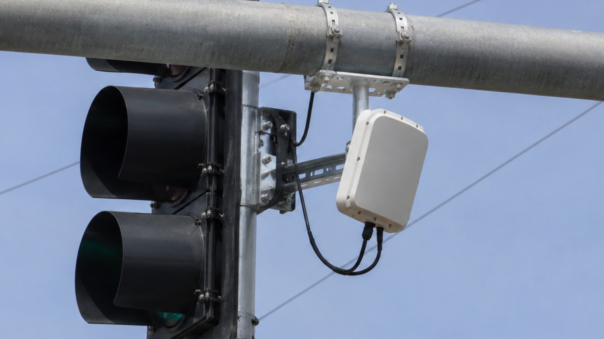 Close up of a white traffic sensor.