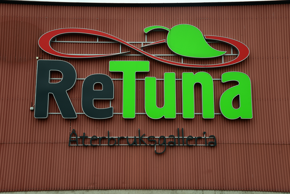 ReTuna Återbruksgalleria sign displayed on the exterior of the secondhand shopping center.