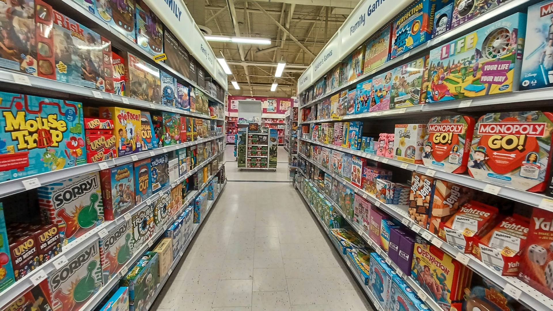 A Toys "R" Us aisle filled with board games.