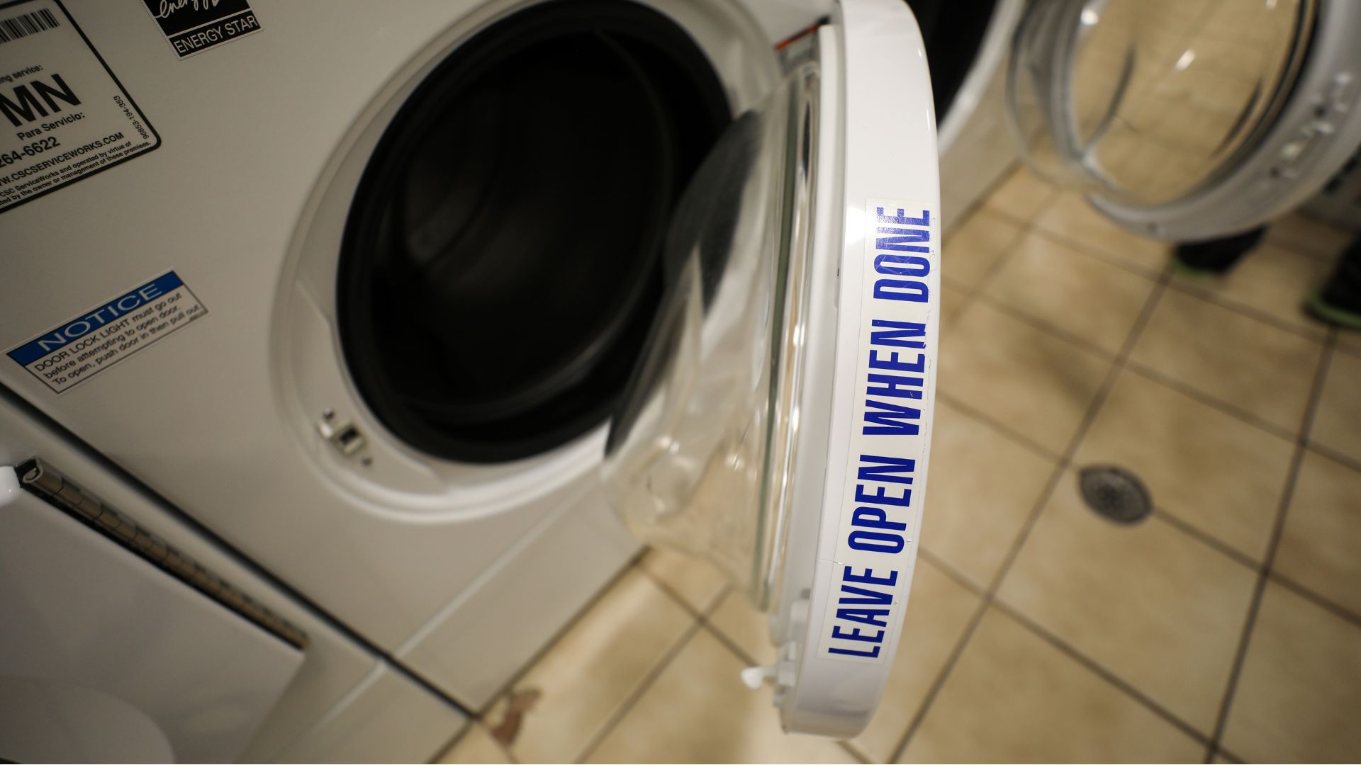 Washing machine door left open to air out.